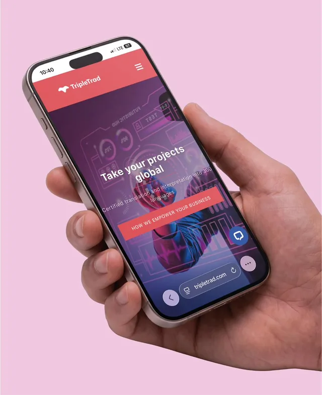 TripleTrad mobile website shown on a smartphone held in hand